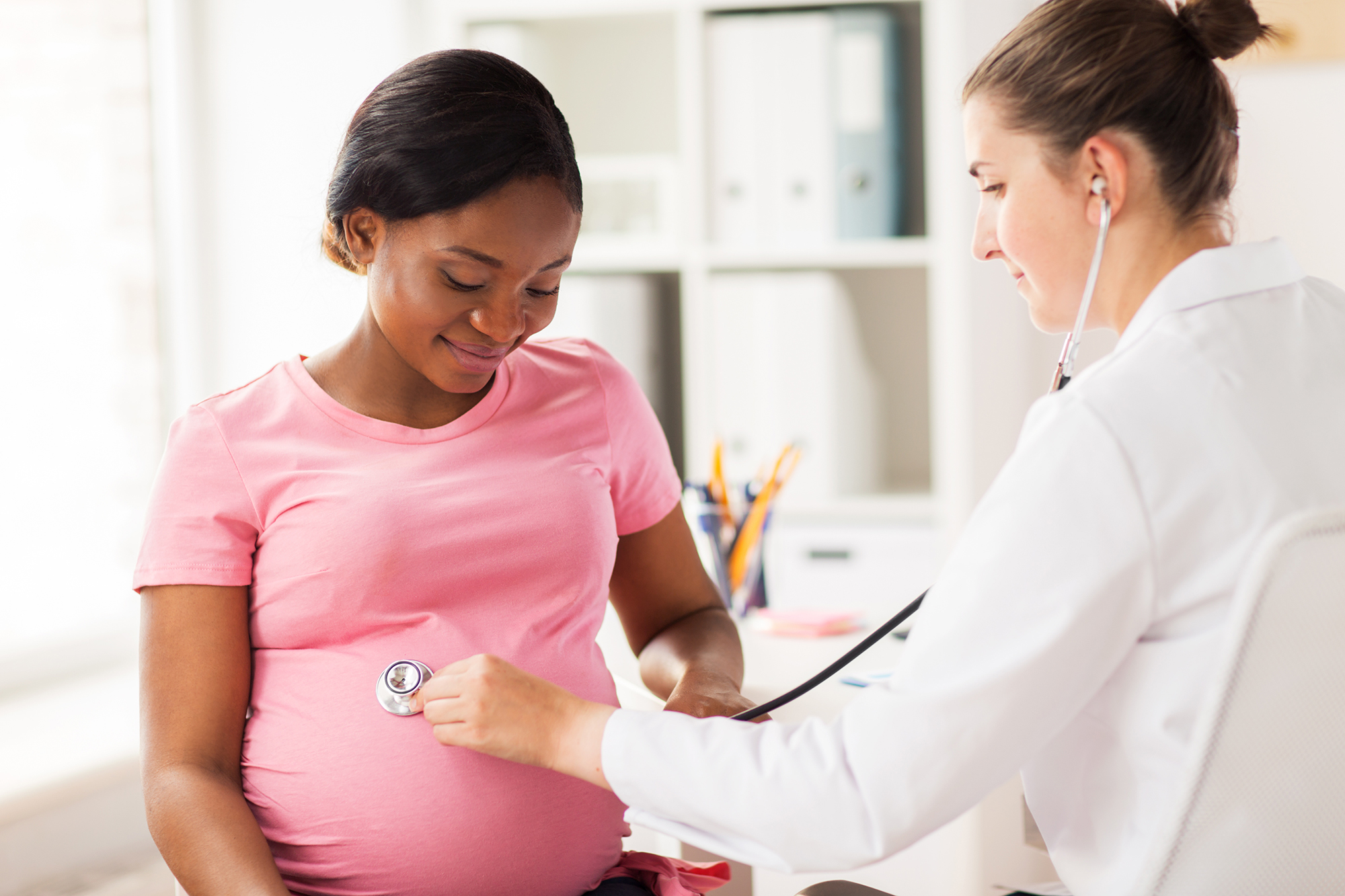 gynecologist doctor and pregnant woman at hospital